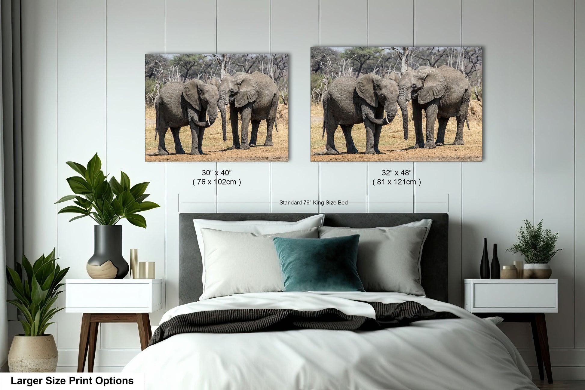 a couple of elephants standing next to each other on a bed