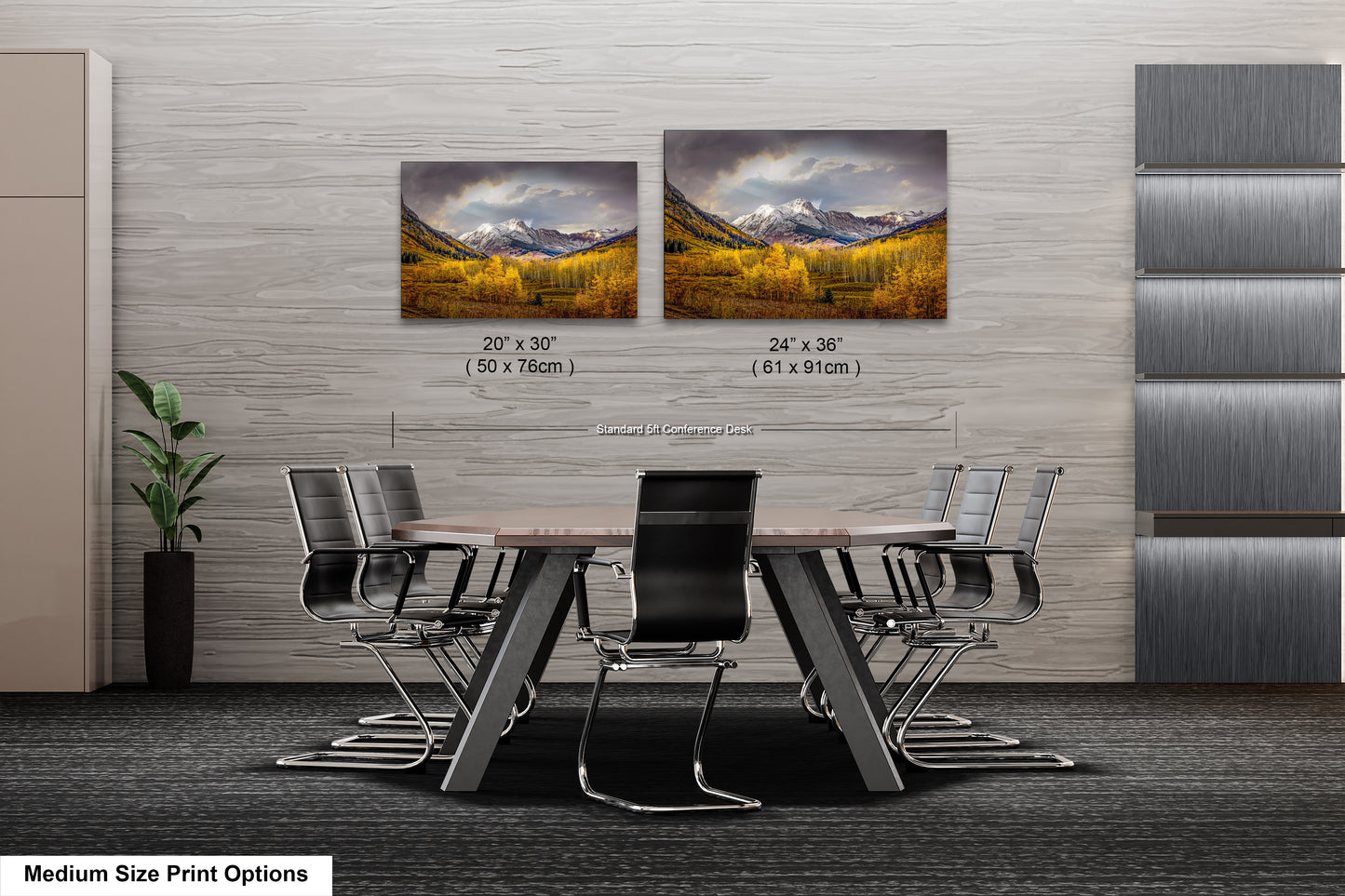 a dining room table with four chairs and two pictures on the wall