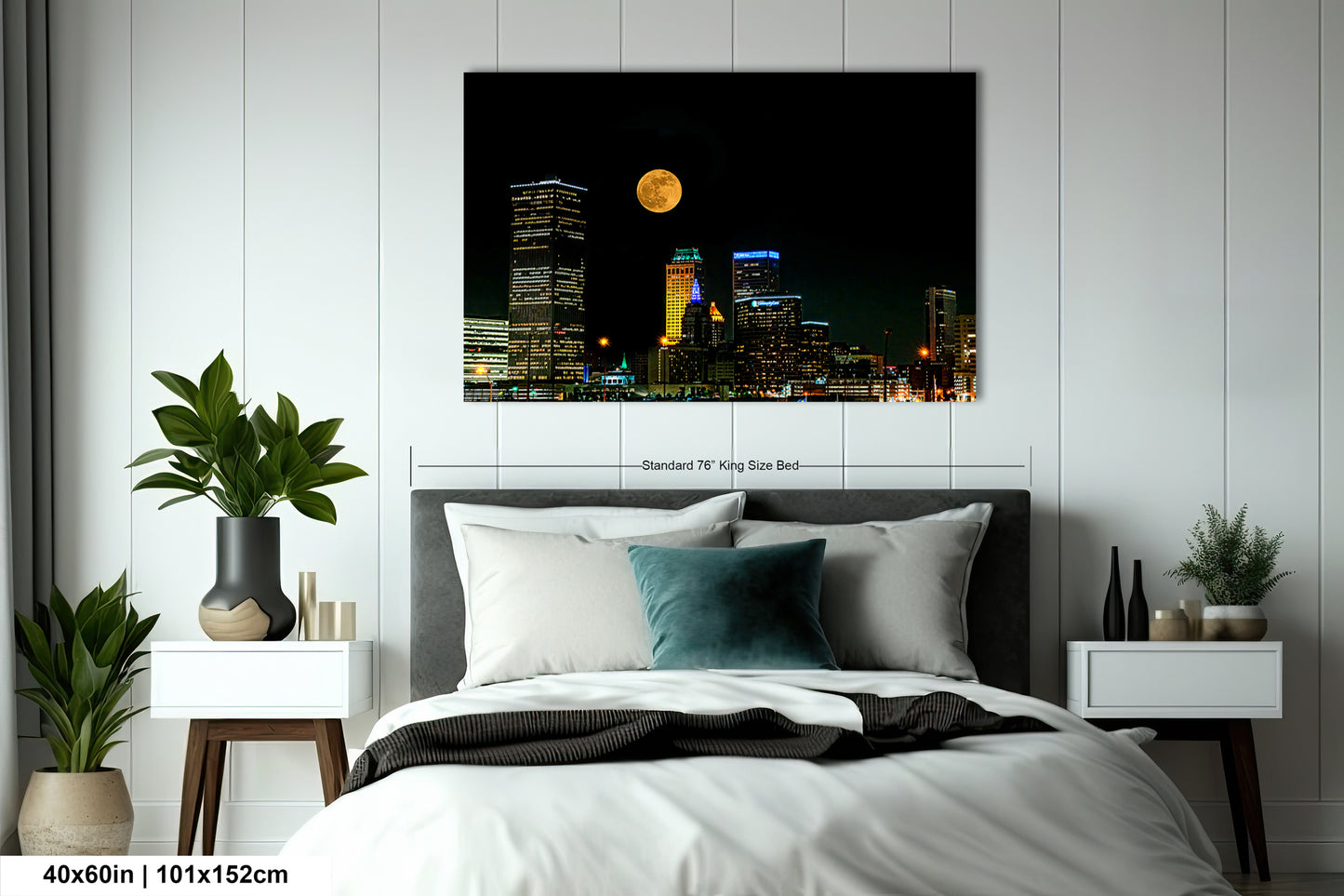 a bed in a room with a picture on the wall
