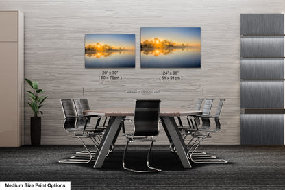 a dining room table with chairs and a picture of a lake