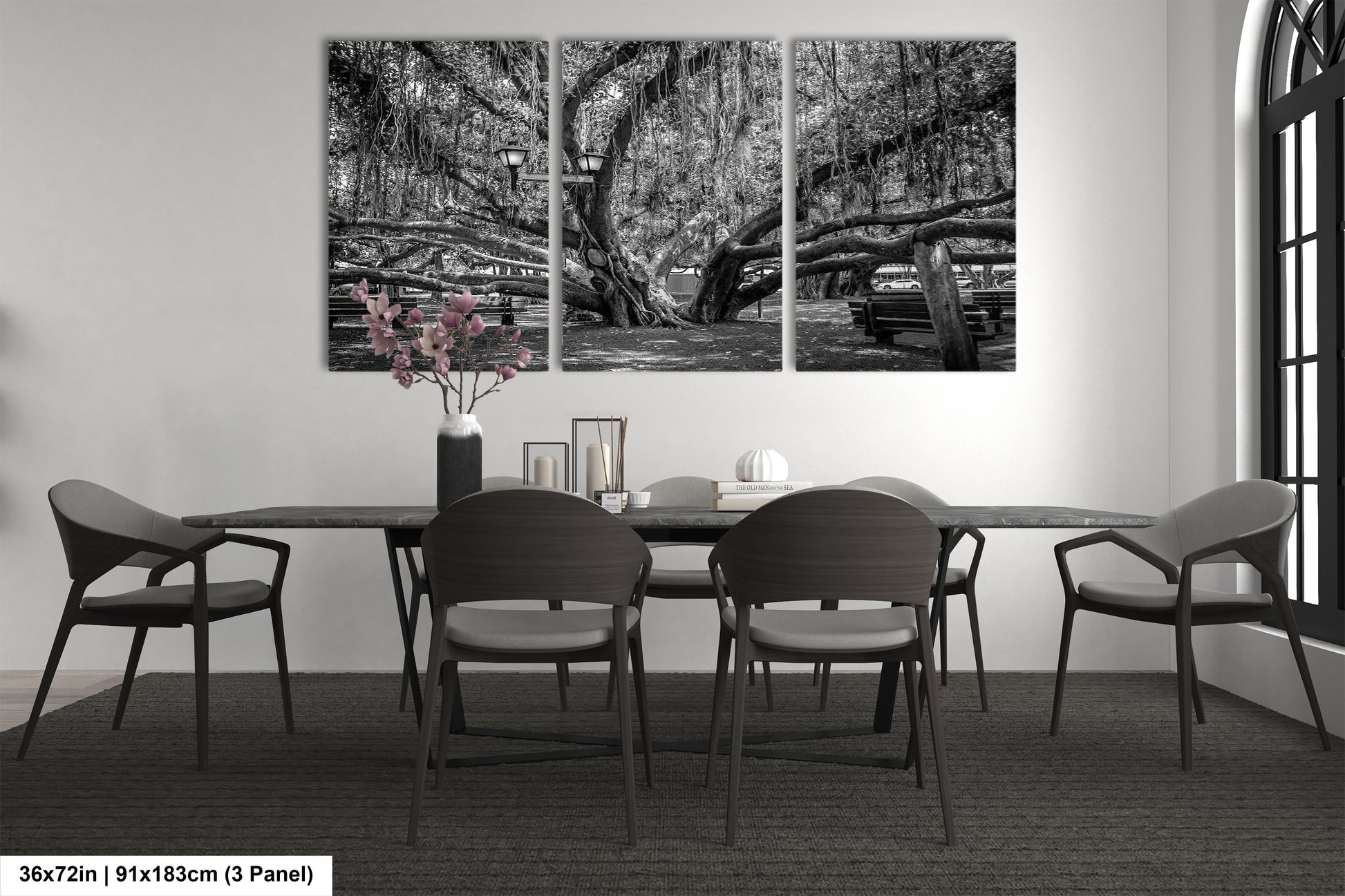 a black and white photo of a dining room table