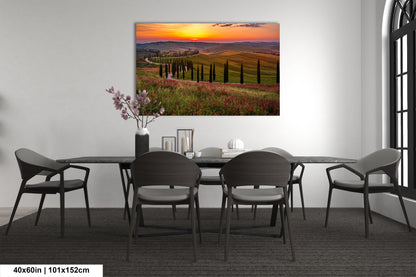 a dining room table with chairs and a painting on the wall