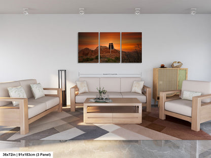 a living room filled with furniture and a painting on the wall