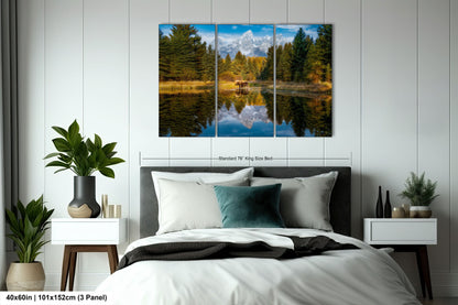 a bed room with a neatly made bed and a painting on the wall