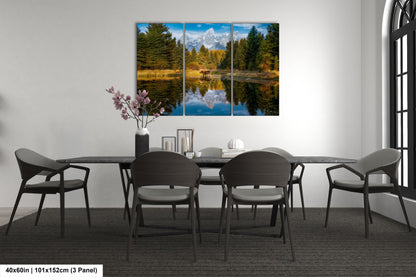 a dining room table with four chairs and a painting on the wall