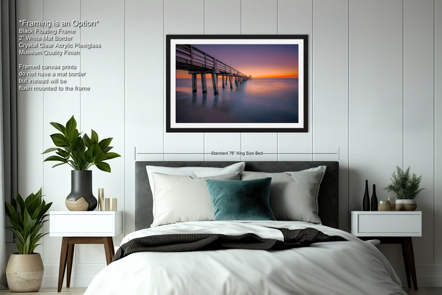 a bedroom with a bed and a picture hanging on the wall
