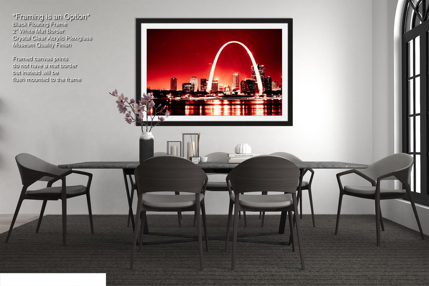 a dining room table with chairs and a picture of the st louis arch