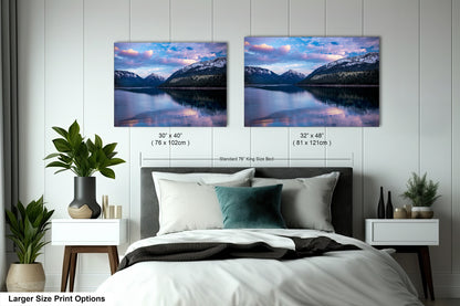 a bedroom with a bed and two pictures on the wall