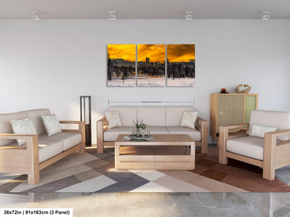 a living room filled with furniture and a painting on the wall
