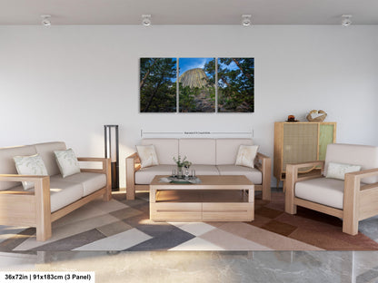 a living room filled with furniture and a painting on the wall