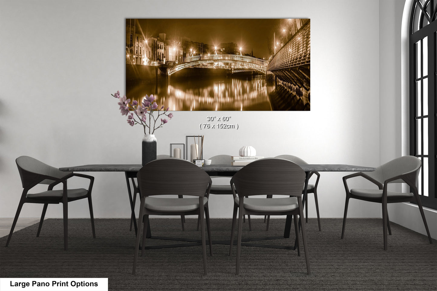 a dining room table with chairs and a painting on the wall