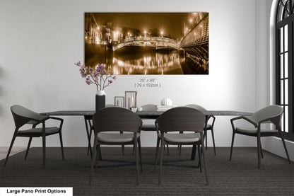 a dining room table with chairs and a painting on the wall