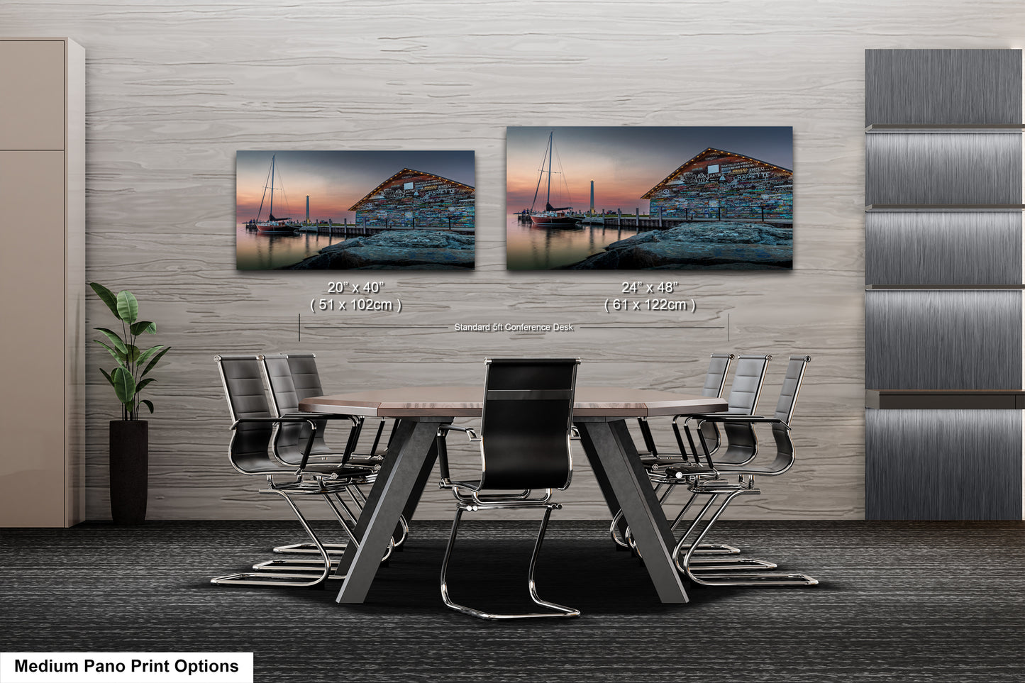 a modern living room with a sofa, two chairs, and a coffee table. There are two framed pictures on the wall, depicting a seascape with a boat and a building. The room has a neutral color scheme with a geometric patterned rug on the floor.