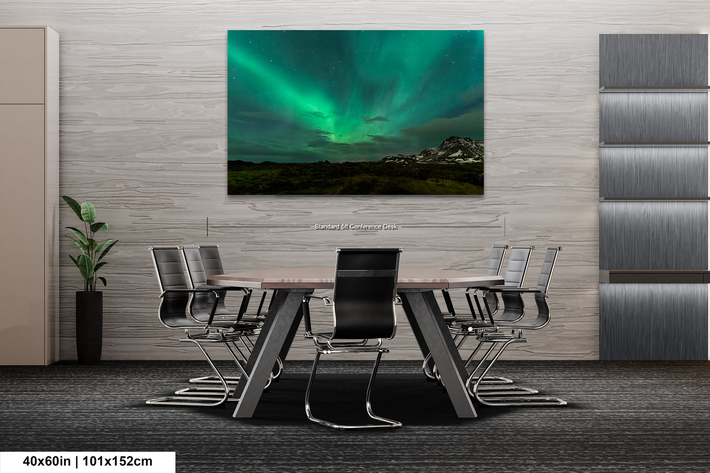 a room with a table and chairs and a painting on the wall