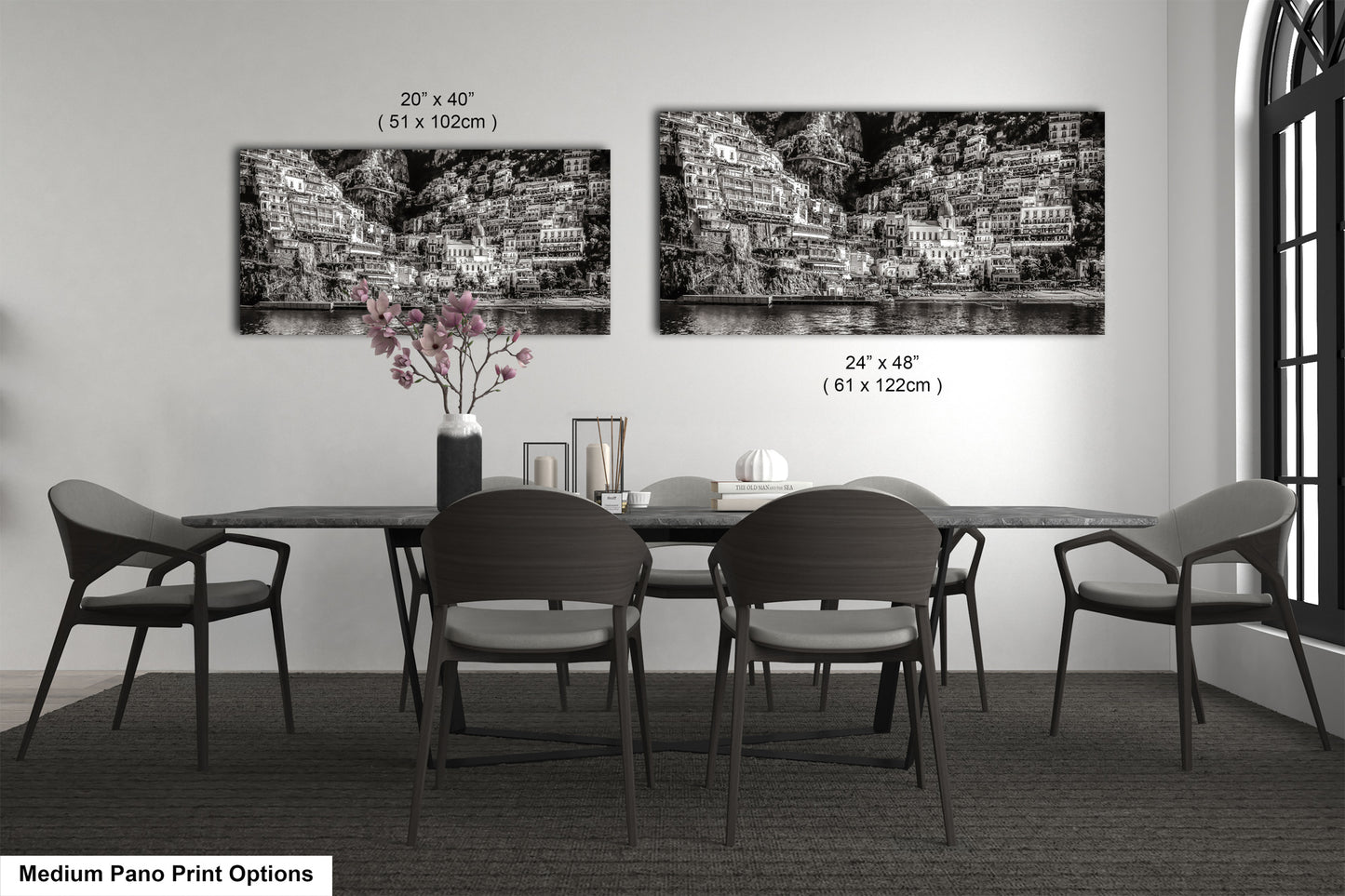 a black and white photo of a dining room table