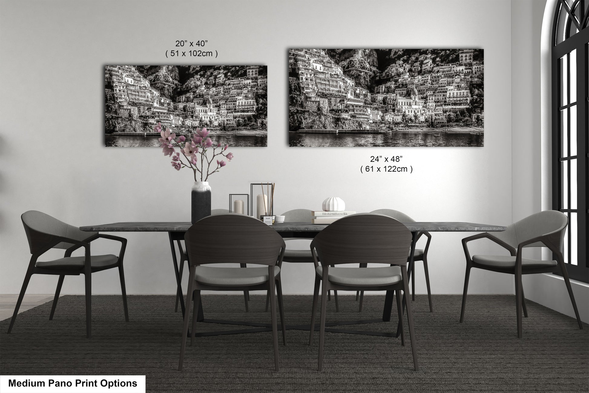 a black and white photo of a dining room table