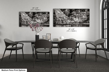 a black and white photo of a dining room table