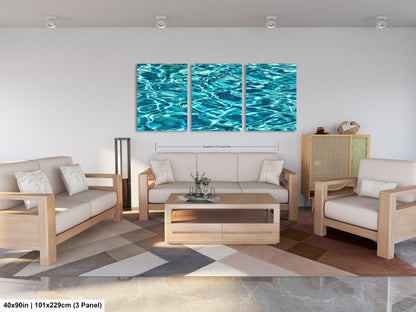 a modern living room with a large, colorful painting of water on the wall. The room is furnished with a sofa, two chairs, and a coffee table. The painting is framed in a 3x3 panel, and the dimensions are provided as 40 inches by 101.229 centimeters.