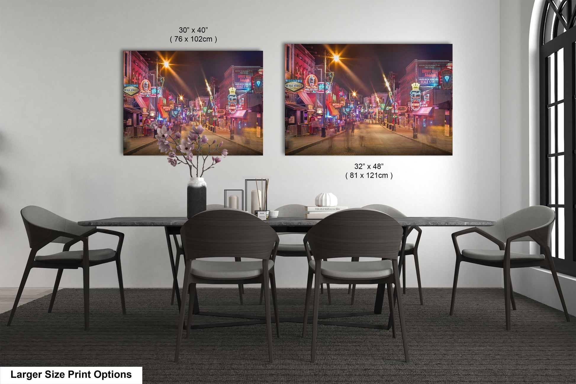 a dining room table with chairs and a vase of flowers