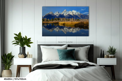 a bedroom with a bed and a painting on the wall