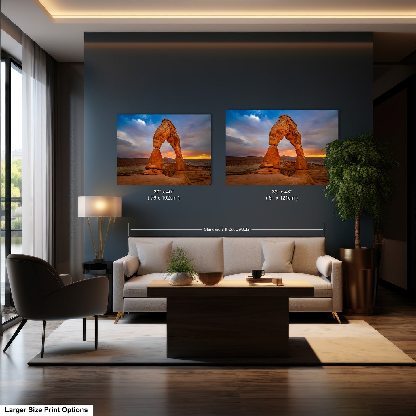 a living room with a couch and two pictures on the wall