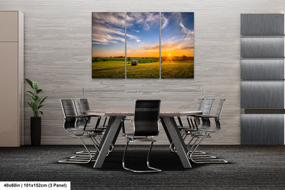 a dining room table with chairs and a painting on the wall