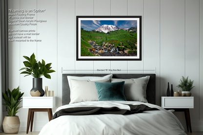 a bedroom with a large bed and a picture on the wall