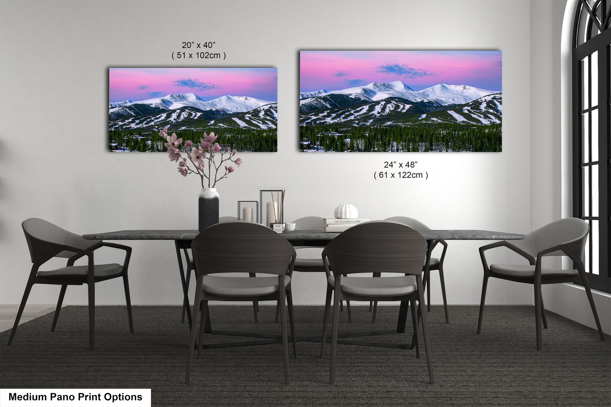 a dining room table with chairs and a vase of flowers