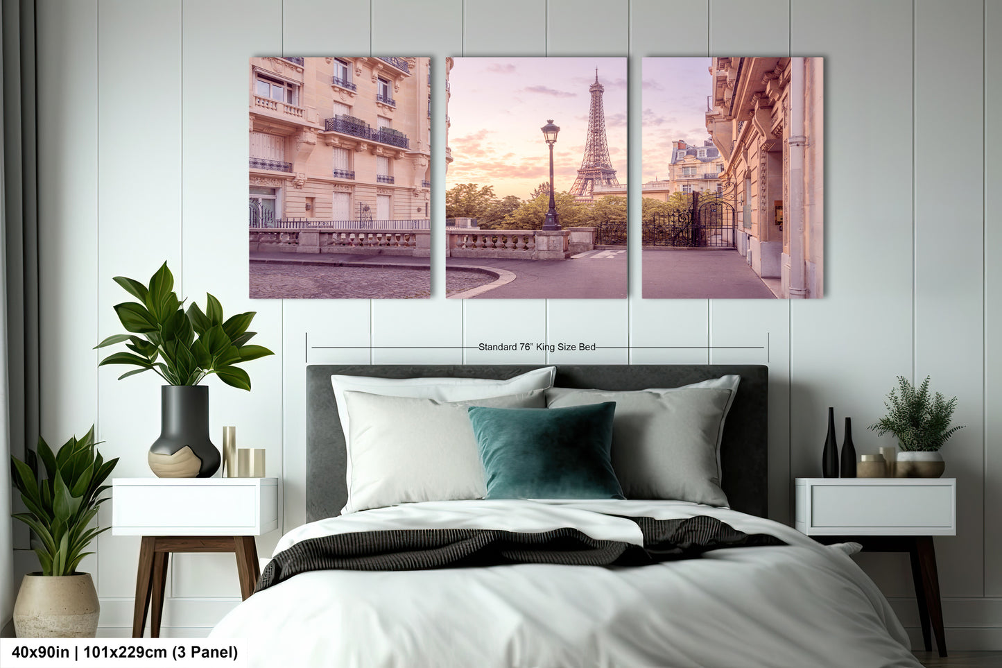 a bedroom with a bed and two pictures of the eiffel tower