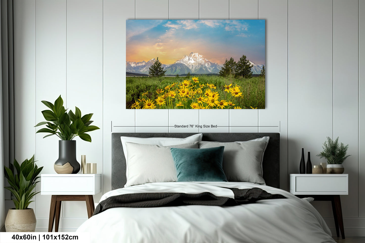 a bed room with a neatly made bed and a painting on the wall