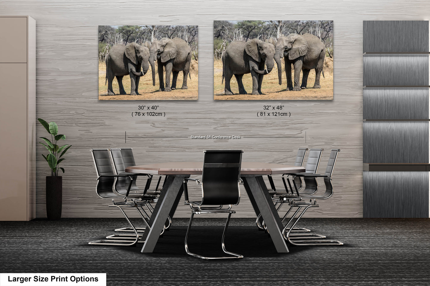 a table with chairs and two pictures of elephants on the wall
