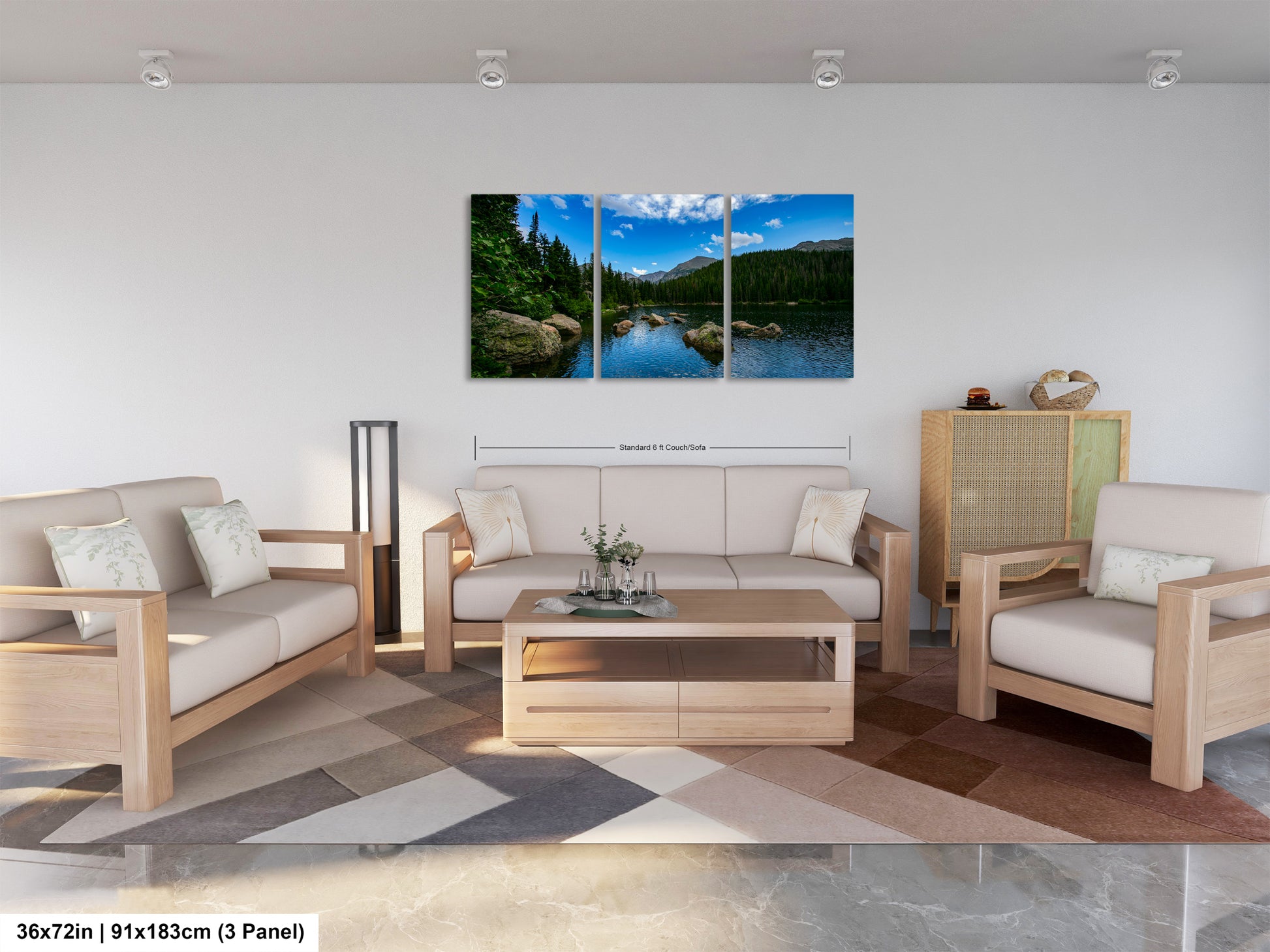The image is a modern living room with a large, three-panel landscape painting hanging on the wall. The painting depicts a serene mountain lake surrounded by trees and mountains, creating a peaceful and natural atmosphere. The room is furnished with a sofa, two armchairs, and a coffee table, providing a comfortable and inviting space for relaxation and socializing.