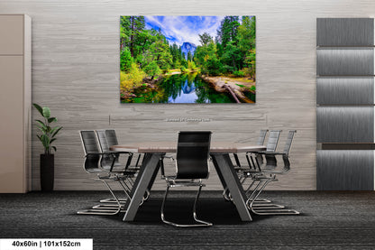 a dining room with a table and chairs and a painting on the wall