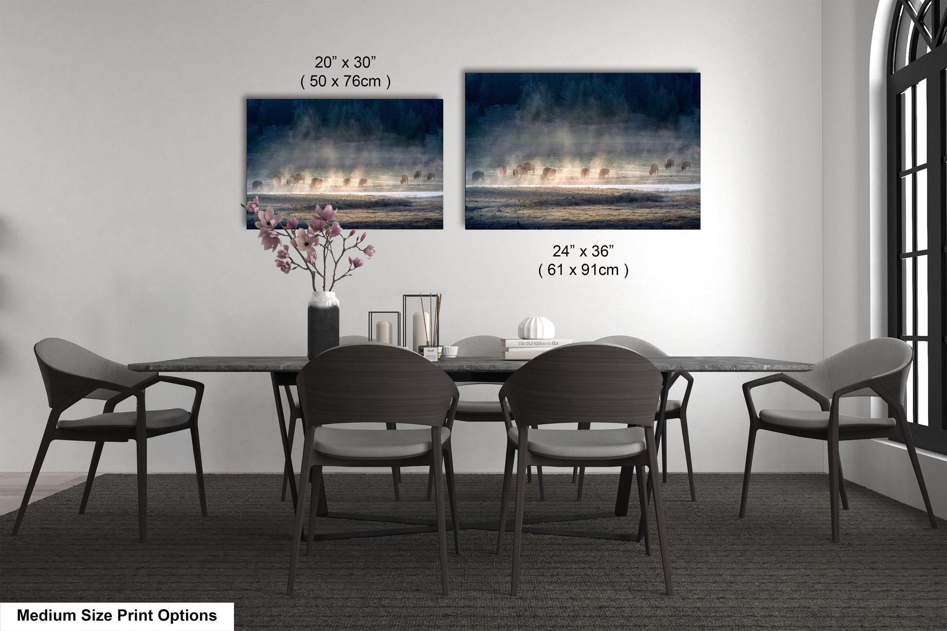 a dining table with four chairs and a vase of flowers