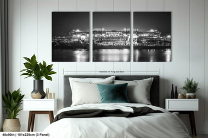 a black and white photo of a bedroom