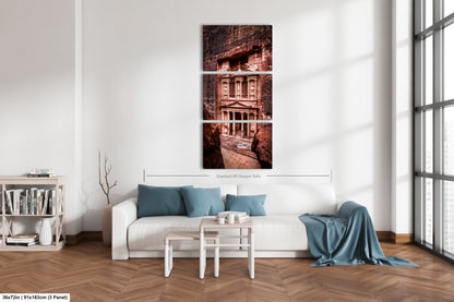 a living room with a white couch and a window