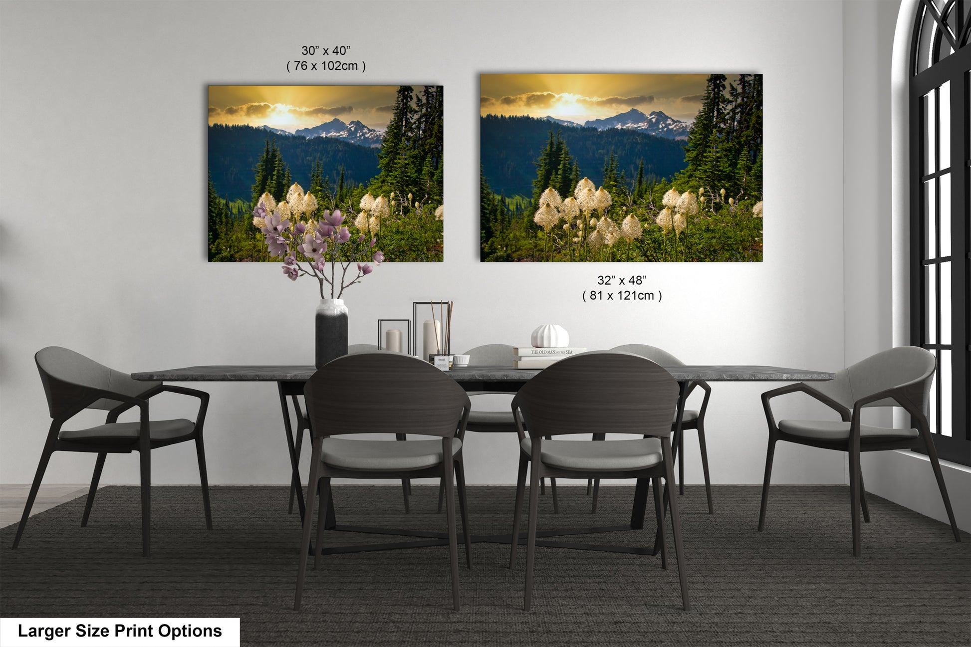 a dining room table with four chairs and a vase of flowers