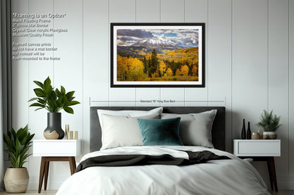 a bedroom with a large bed and a painting on the wall