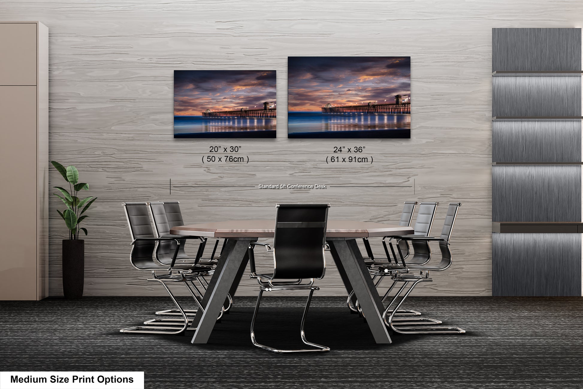 a dining room table with chairs and two pictures on the wall