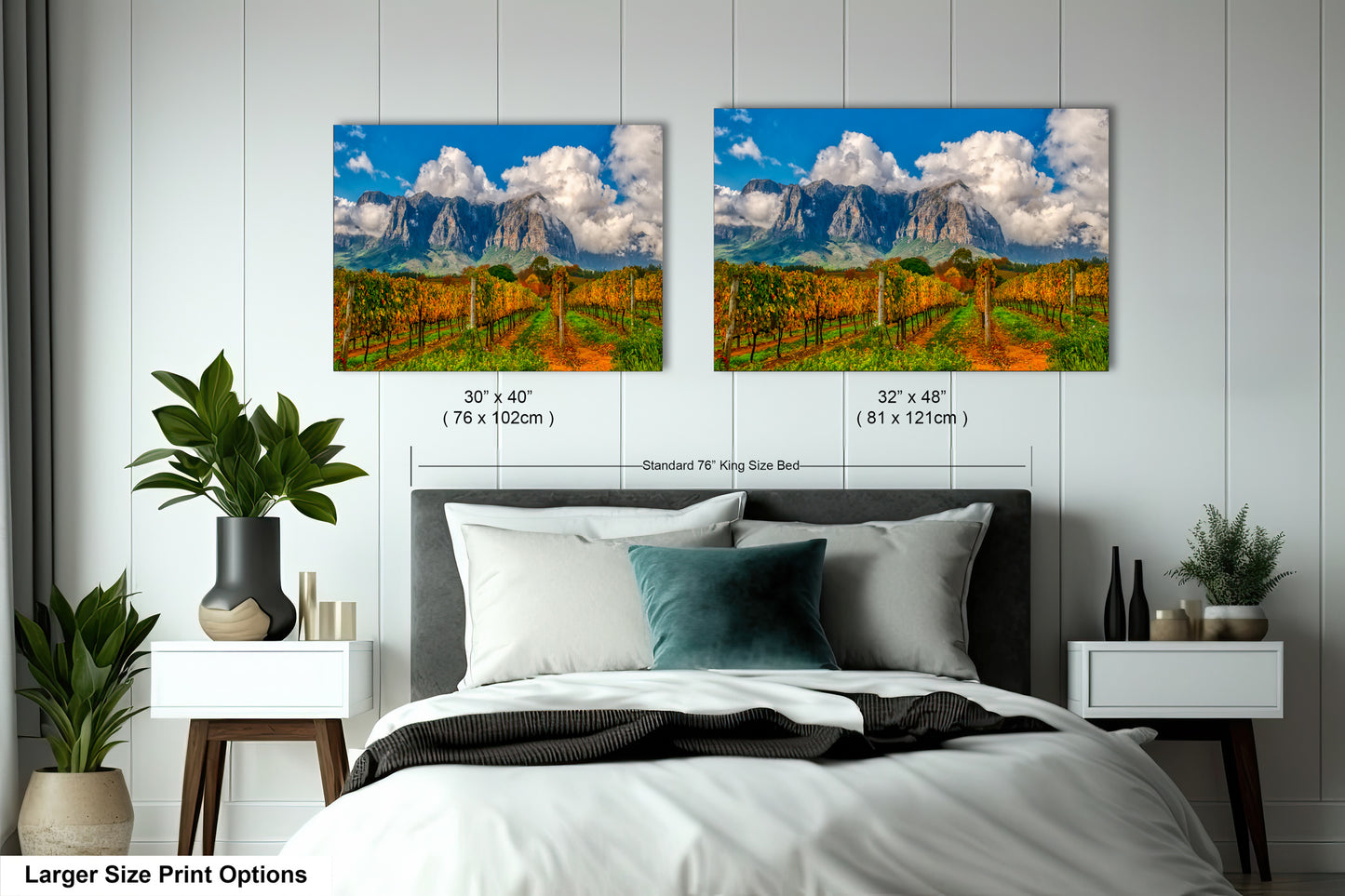 a bedroom with a bed and two pictures on the wall