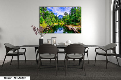 a dining room table with chairs and a painting on the wall