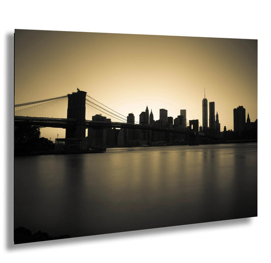 a black and white photo of a bridge and a city