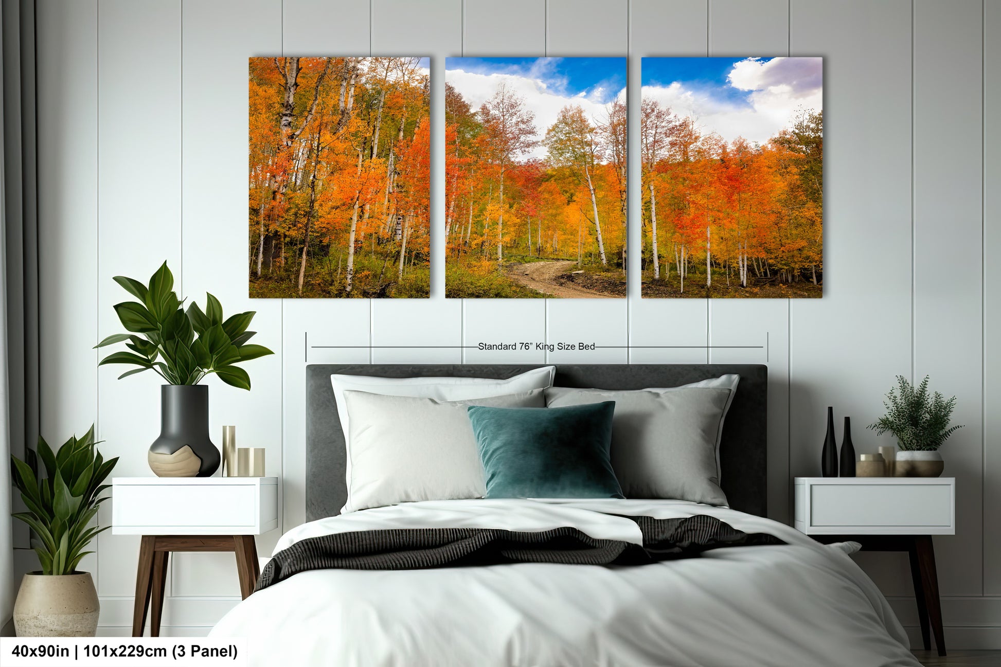 a bed room with a neatly made bed and two paintings on the wall