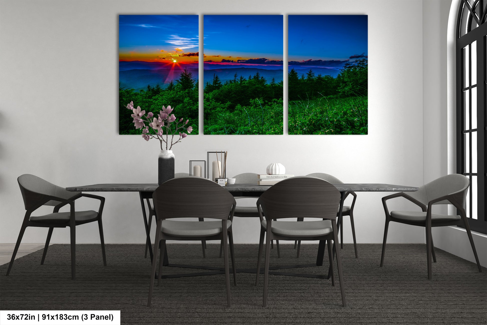 a dining room table with four chairs and a painting on the wall