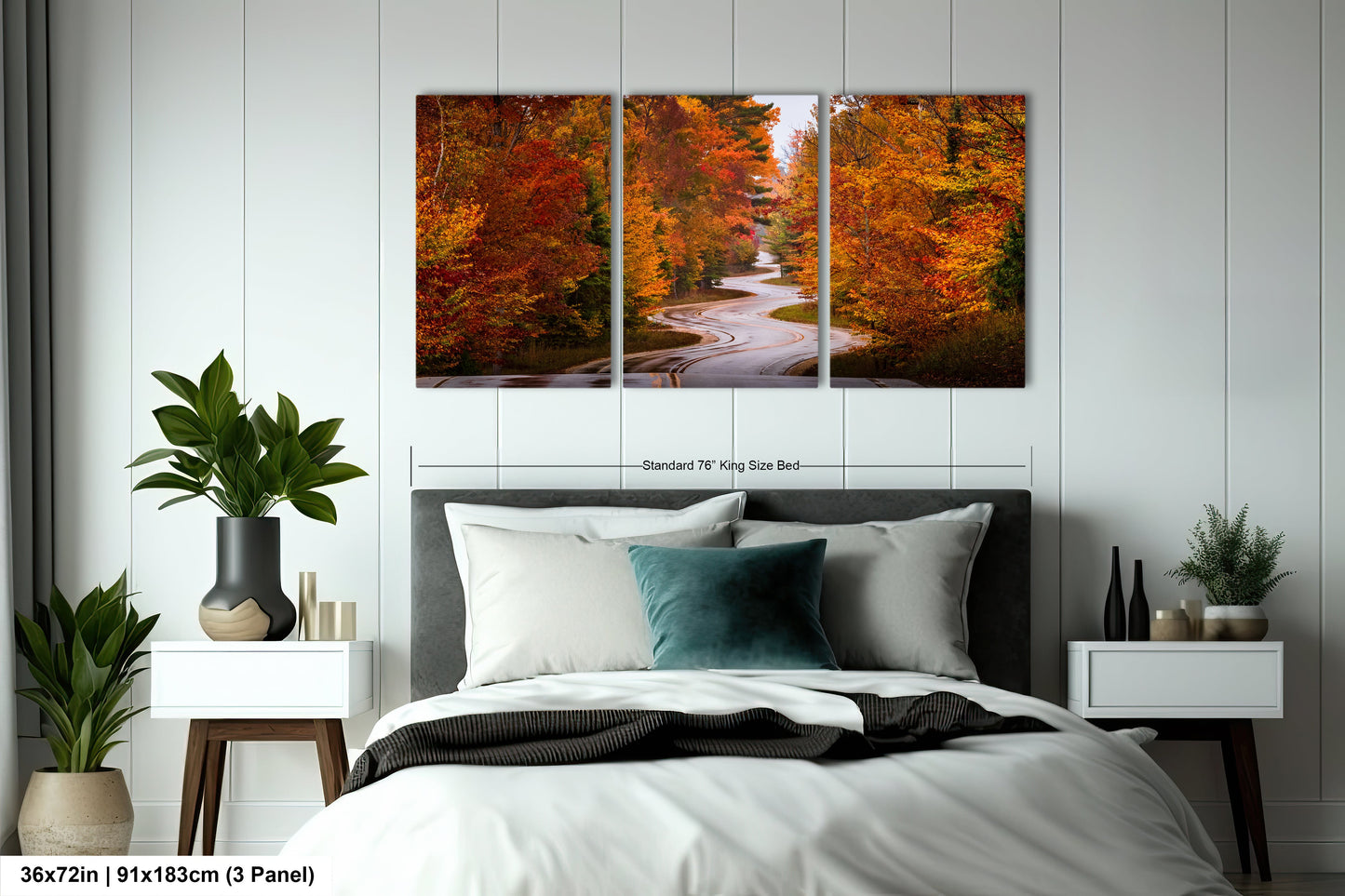 a bedroom with a bed and two paintings on the wall