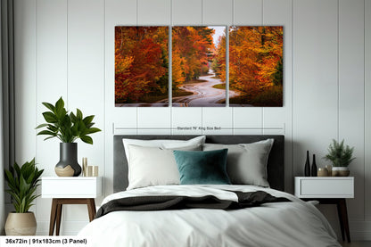 a bedroom with a bed and two paintings on the wall