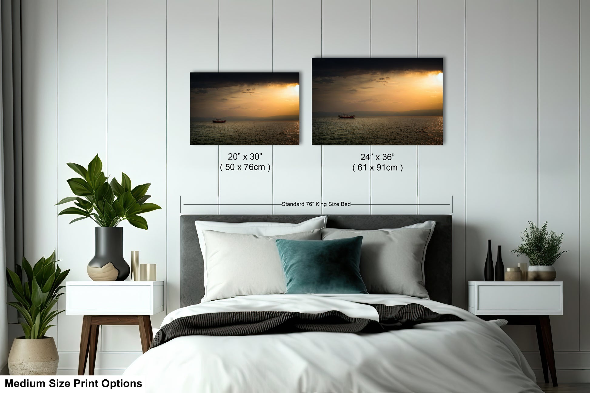 a bed with two pictures on the wall above it