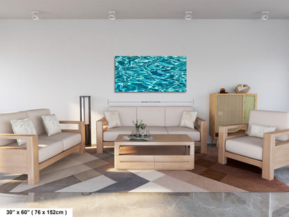 a modern living room with a large, vibrant blue and white abstract painting hanging on the wall above a wooden coffee table. The room is furnished with a sofa, two armchairs, and a wooden cabinet. The furniture appears to be made of light-colored wood, and the floor is covered with a patterned rug. The painting is approximately 60 inches wide and 76 millimeters tall, and the room is well-lit with recessed lighting.