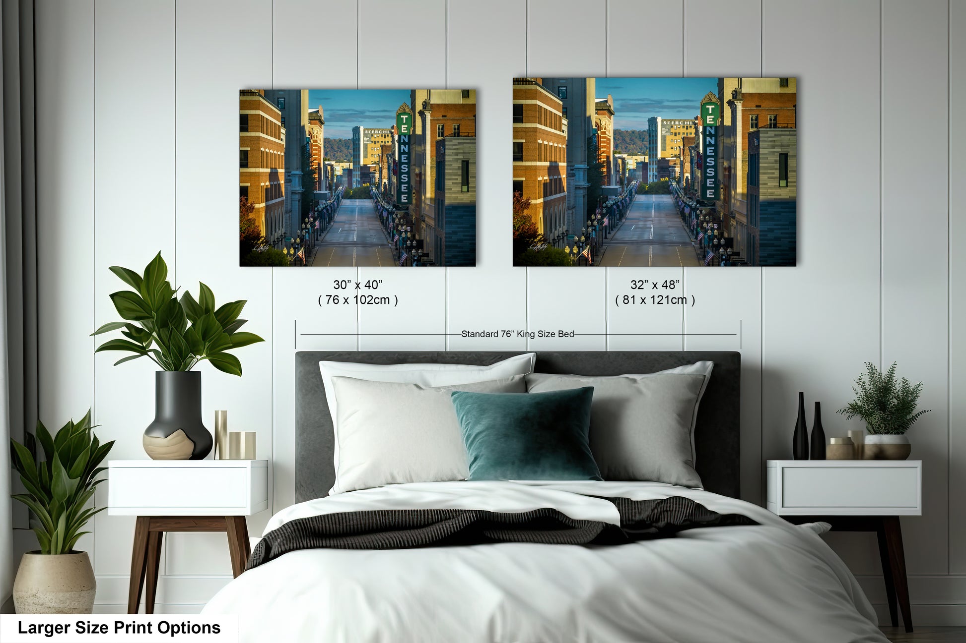a bedroom with a bed and two pictures on the wall