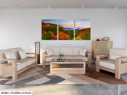 a living room filled with furniture and a painting on the wall